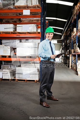 Image of Confident Supervisor With Clipboard At Warehouse