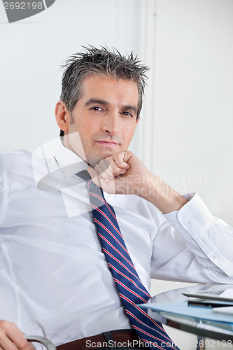 Image of Businessman Relaxing In Office