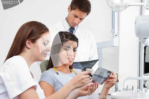 Image of Female Nurse Explaining X-Ray Report To Patient