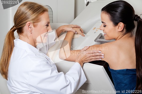 Image of Doctor Assisting Patient During Mammography