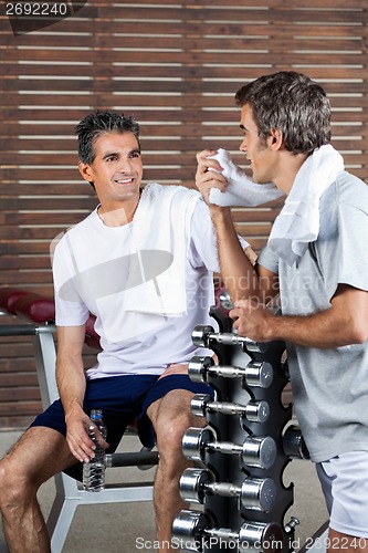 Image of Men Looking At Each Other After Work Out