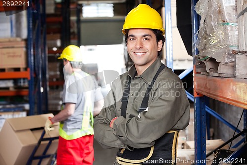 Image of Young Foreman With Arms Crossed At Warehouse