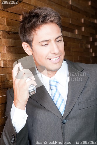 Image of Man with a Bottle of Perfume