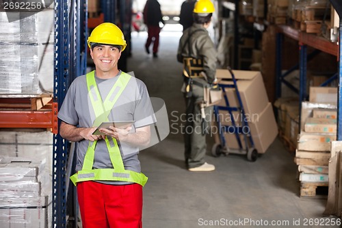 Image of Mid Adult Foreman With Digital Tablet At Warehouse