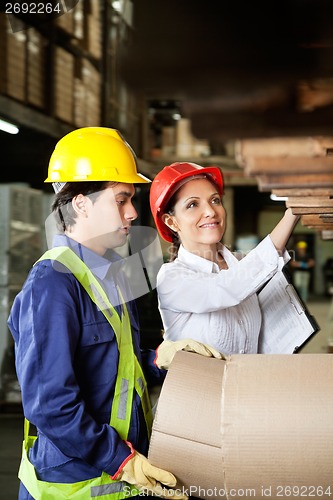 Image of Supervisor And Foreman Checking Stock