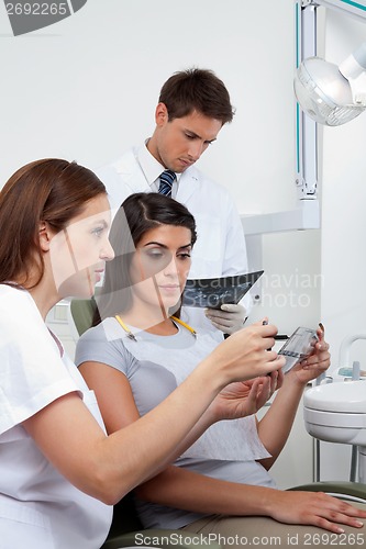 Image of Nurse Explaining X-Ray Report To Patient