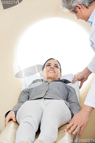 Image of Doctor Preparing Woman For CT Scan Test