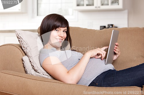 Image of Pregnant Woman Using Digital Tablet