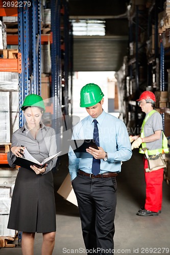 Image of Supervisors And Foreman Working At Warehouse