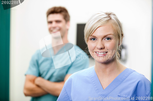 Image of Young Female Vet In Scrubs Smiling