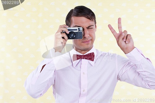 Image of Retro Male Using Old Camera