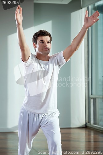 Image of Man Exercising At Gym