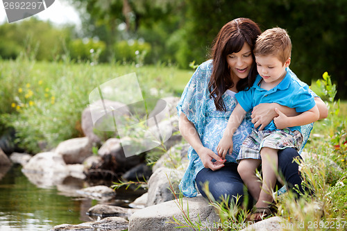 Image of Mother and Son Playing Near Lake