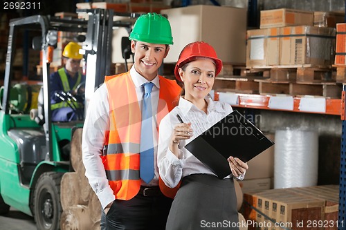 Image of Two Confident Young Supervisors At Warehouse