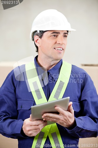 Image of Foreman With Digital Tablet Standing in Warehouse