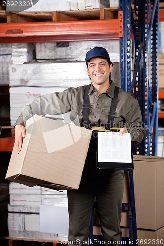 Image of Supervisor With Clipboard And Cardboard Box