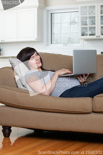 Image of Relaxed Pregnant Woman Using Laptop