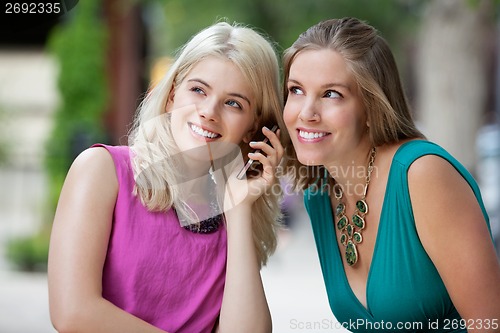 Image of Women Using A Mobile Phone