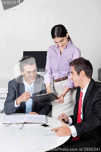 Image of Happy Businesspeople In Meeting