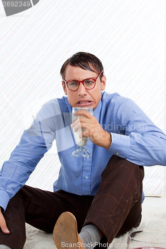 Image of Man holding Glass of Milk