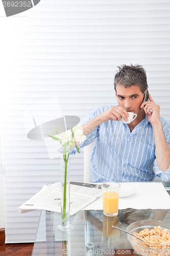 Image of Mature Man Having Breakfast