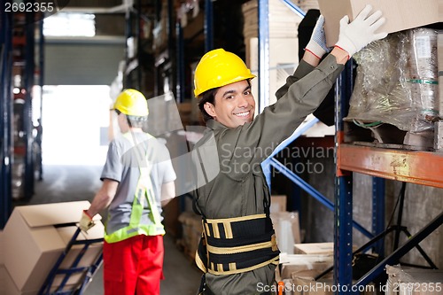 Image of Foreman With Coworker Working At Warehouse