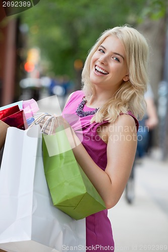 Image of Excited Shopaholic Woman