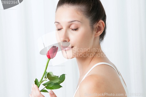 Image of Young Woman with a Rose