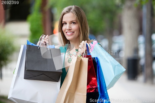 Image of Happy Woman with Shopping Bags