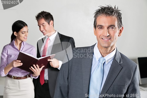 Image of Confident Businessman Smiling