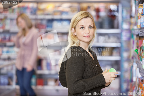 Image of Young Woman Shopping At Supermarket