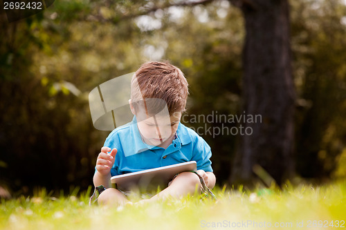 Image of Young Boy with Digital Tablet
