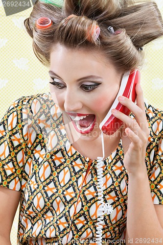 Image of Woman Screaming While Holding Retro Phone