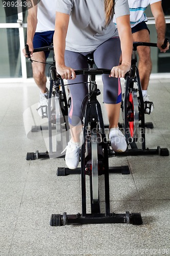 Image of Low Section Of People On Exercise Bikes