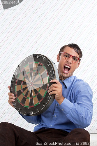 Image of Man Holding a Dartboard