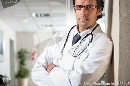 Image of Doctor Standing With Hands Folded