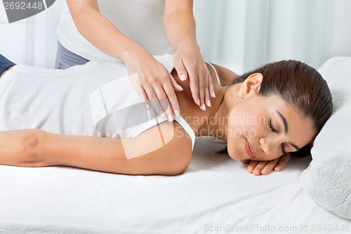 Image of Woman Receiving Back Massage