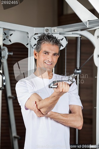 Image of Man Working Out In Fitness Center