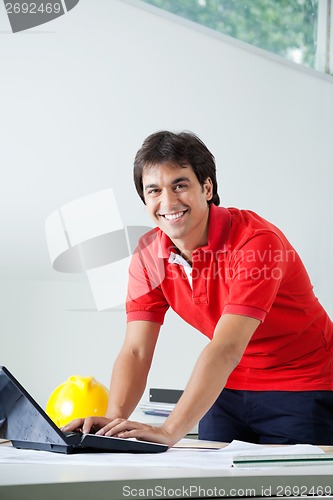 Image of Male Architect Using Laptop