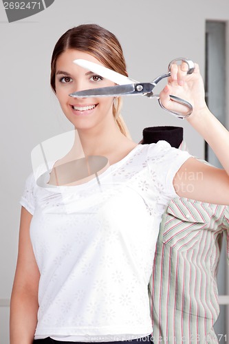 Image of Female Dressmaker Holding scissors