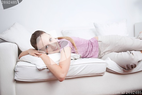 Image of Young Woman Lying on Couch