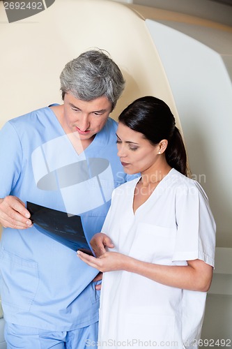 Image of Technicians Looking At X-ray