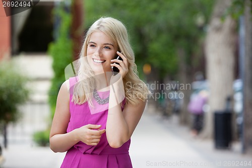Image of Happy Woman Talking on Mobile Phone