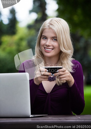 Image of Young Woman with Smart Phone