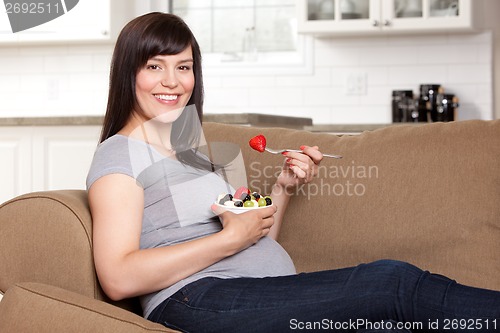 Image of Pregnant Woman Eating Healthy Snack