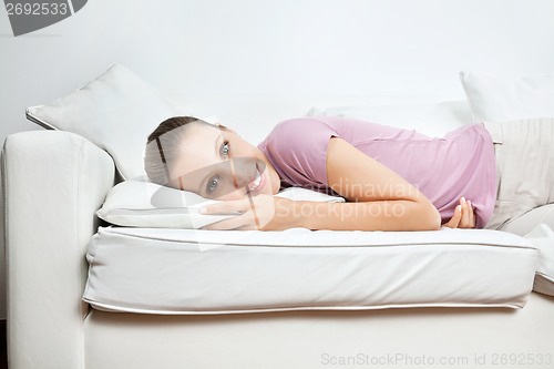 Image of Woman Relaxing On Sofa