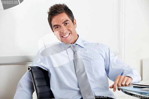 Image of Handsome Young Businessman Smiling