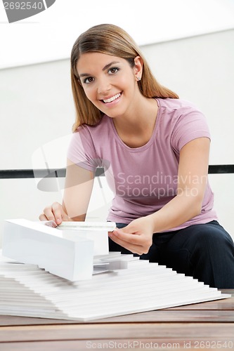 Image of Architect Working On Model