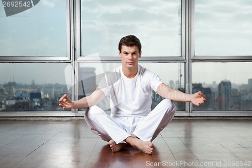 Image of Young Man Practicing Yoga