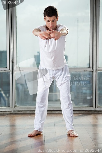 Image of Man Performing A Stretching Exercise